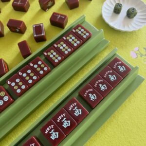 Cherry Red American Mahjong tiles arranged on racks