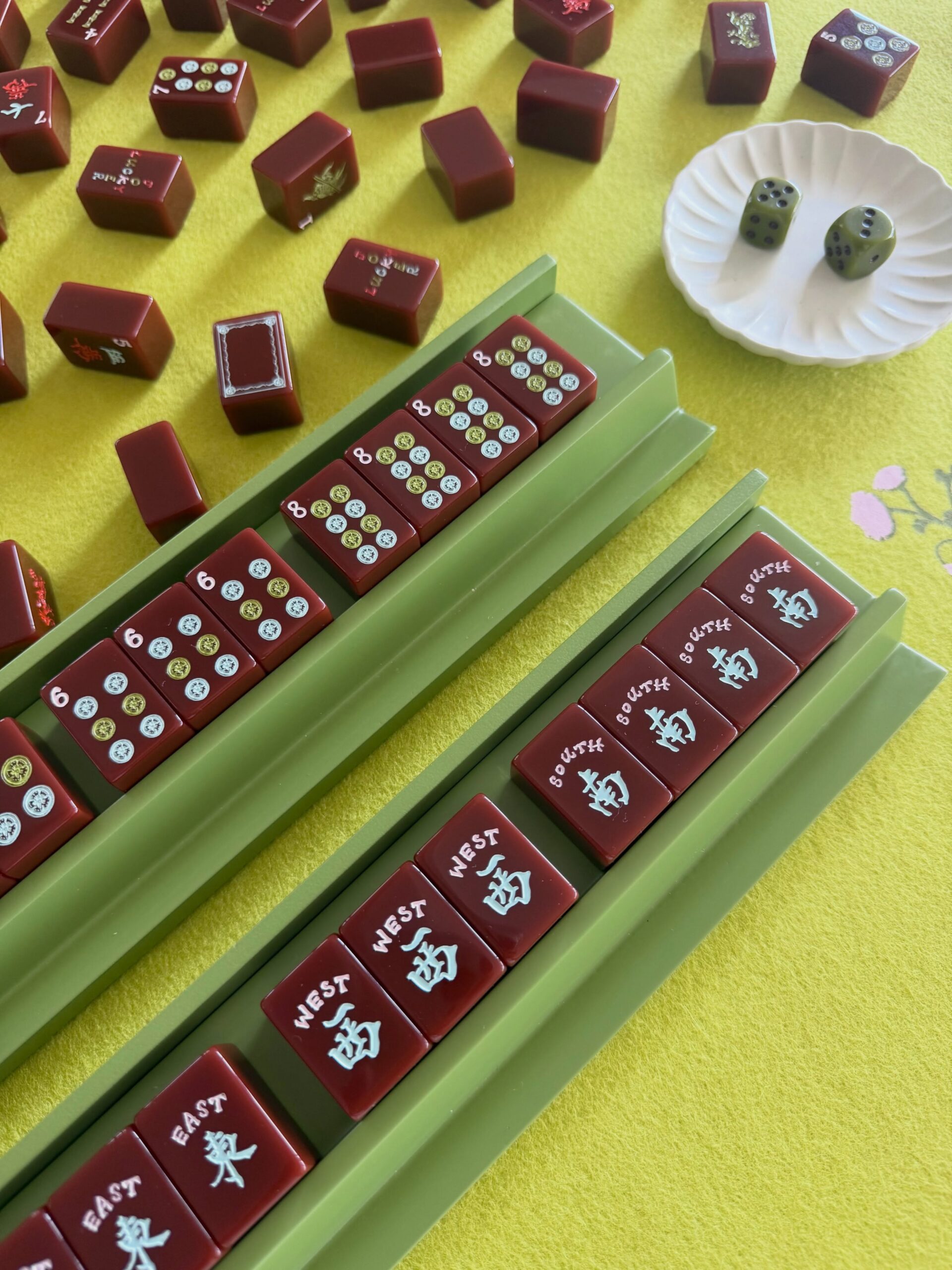 Cherry Red American Mahjong tiles arranged on racks